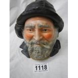 An early 20th century tobacco jar in the form of a fisherman's head.