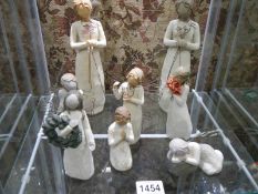 A quantity of Willow Tree figures.