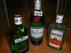 A bottle of Gordon's gin, Tanqueray gin and Barbados rum.