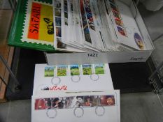 A Safari stamp album and a quantity of first day covers.
