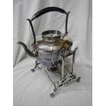 An early 20th century silver plate kettle on stand.