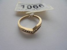 A 9ct gold ring fashioned as a wishbone, set diamonds, size N, 2.6 grams, .15 carat.