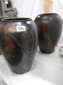 A pair of tall bronze vases marked WMF 11.737A