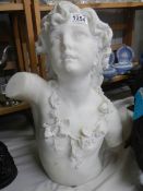 A heavy Italian marble bust of a young girl, 47 cm tall.