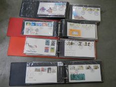 Four albums of first day covers.