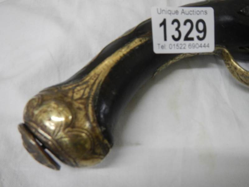 A 19th century flint lock pistol with brass inlay. - Image 4 of 4