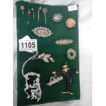 A good lot of brooches and stick pins including some silver.