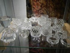 A quantity of cut glass napkin rings.