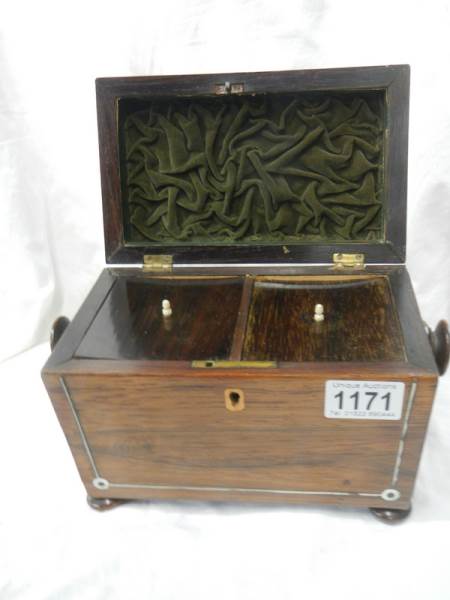 A Victorian rosewood tea caddy in very good condition.