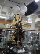 A 20th century bronze effect triple light figural table lamp. COLLECT ONLY.