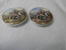 Two antique pot lids.