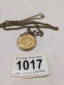 An 1896 Victoria Old Head gold sovereign on a 9ct gold chain, total weight 14.9 grams.