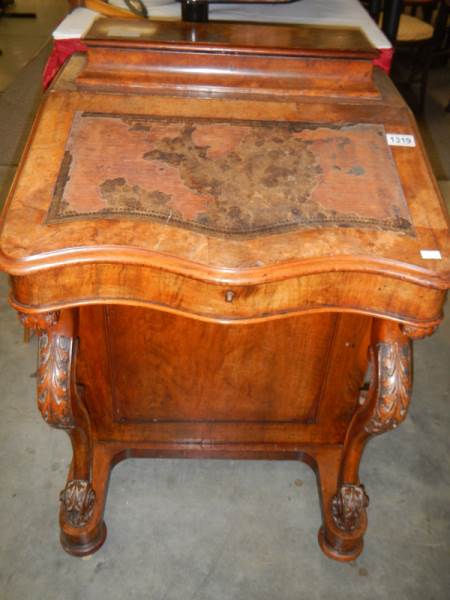 A Victorian walnut Davenport, 82 cm high.