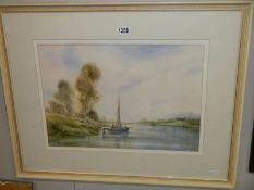 A framed and glazed watercolour river with boat signed Edward Emerson.