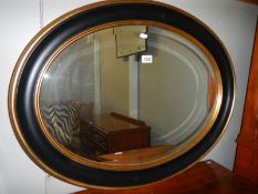 A good quality oval framed bevel edged mirror, COLLECT ONLY.