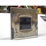 A hall marked silver photograph frame.