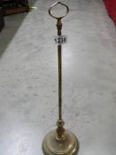 A mid 20th century brass door stop.