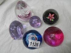 Six good glass paperweights including Caithness,.
