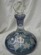 A blue overlaid glass decanter.