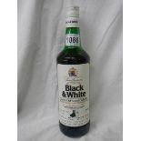 A bottle of Black & White Old Scotch Whisky,.