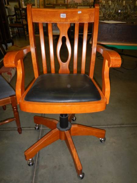 A pale mahogany swivel office chair, COLLECT ONLY.