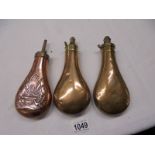 Three Victorian copper gun powder flasks.