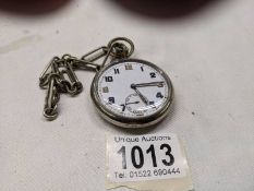 A military issue pocket watch on chain marked GS/TP, serial number 034923