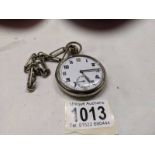A military issue pocket watch on chain marked GS/TP, serial number 034923