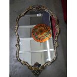 A mid 20th century mirror in decorative frame, COLLECT ONLY