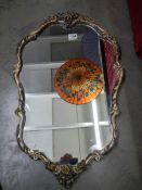 A mid 20th century mirror in decorative frame, COLLECT ONLY