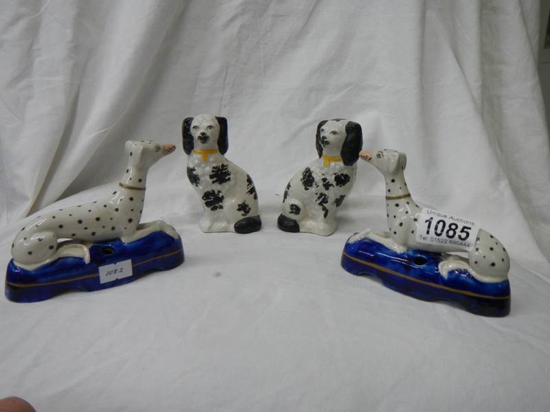 A pair of Samson style Dalmation pen stands and a small pair of Staffordshire spaniels.