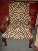 A carved mahogany Gainsborough chair on ball and claw feet, COLLECT ONLY.