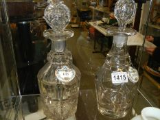 Two early 20th century decanters with labels.