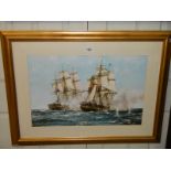 A framed and glazed print featuring sailing ships.