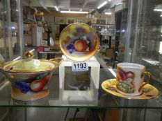 An Aynsley tea cup and saucer together with two items of Japanese porcelain.