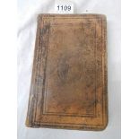 An early leather bound New Testament (damage to back of book),