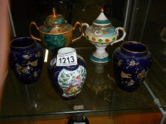 Two porcelain lidded urns, a pair of gilt decorated vases and a ginger jar missing lid.