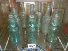 A mixed lot of old glass bottles.