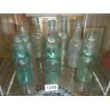 A mixed lot of old glass bottles.
