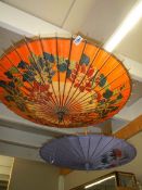 Two hand painted parasols.