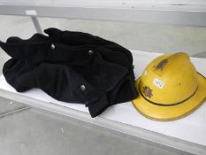 A vintage Humberside fire brigade helmet and a jacket.