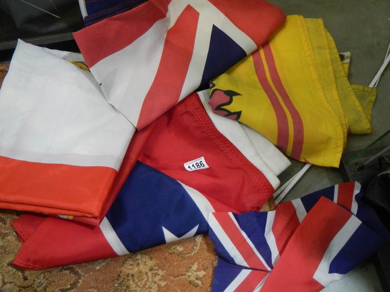 A quantity of assorted cloth flags.