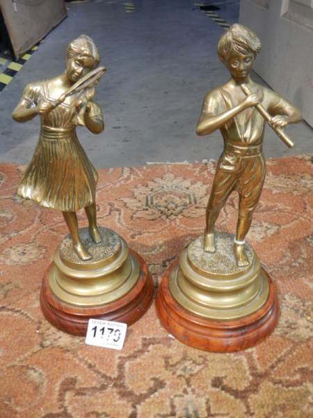 A pair of heavy brass figures.