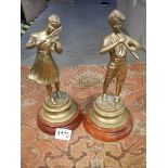 A pair of heavy brass figures.