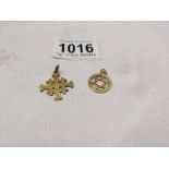 A 14ct gold cross pendant, 1.8 grams and a 9ct gold Star of David, 1 gram.