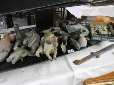 A shelf of assorted Inuit carvings etc.,