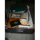 A large box of mixed postcards, stamps and albums etc.,