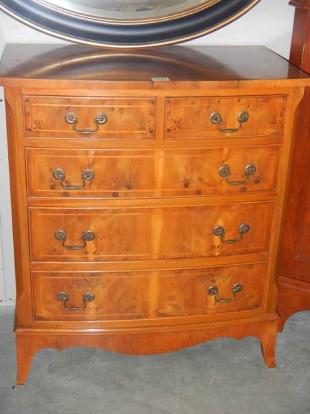 A walnut bow fronted two of three chest of drawers with string inlay. COLLECT ONLY.