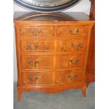 A walnut bow fronted two of three chest of drawers with string inlay. COLLECT ONLY.