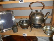 A silver plate kettle on stand and other silver plate.